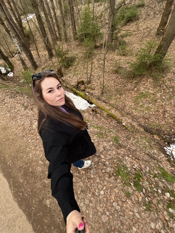 Mother and baby enjoy spring forest outing in Chaikovsky