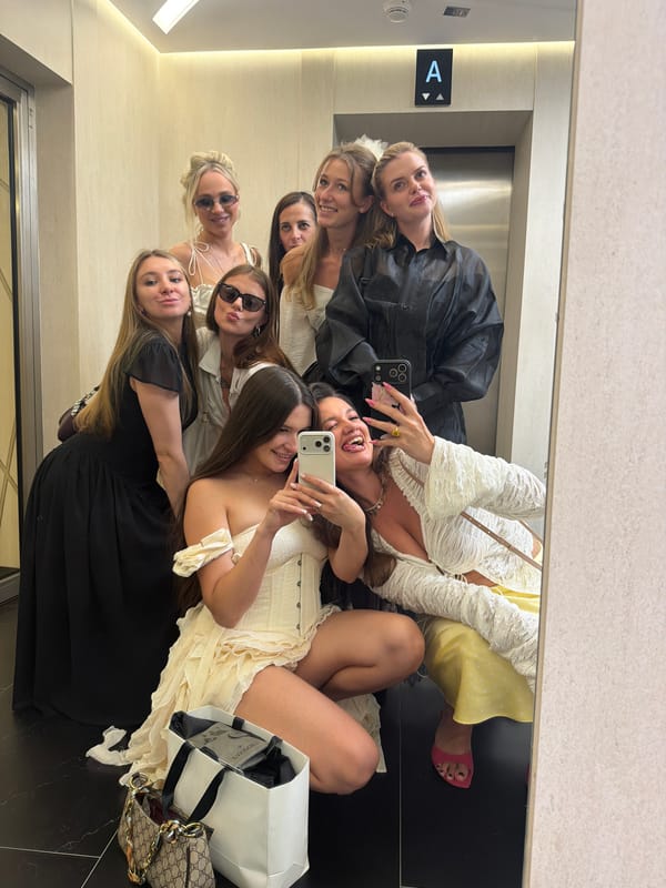 Group elevator selfie session in Khimki, mostly white dresses