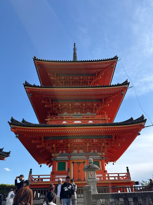 Traditional Kyoto pagoda documented by visitors during morning hours