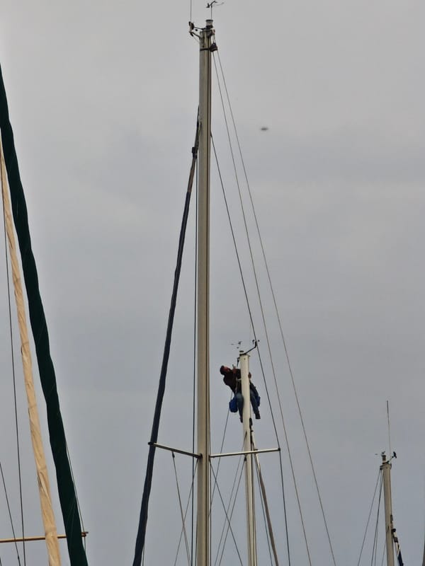 Sailor performs rigging work at Finike marina Friday morning