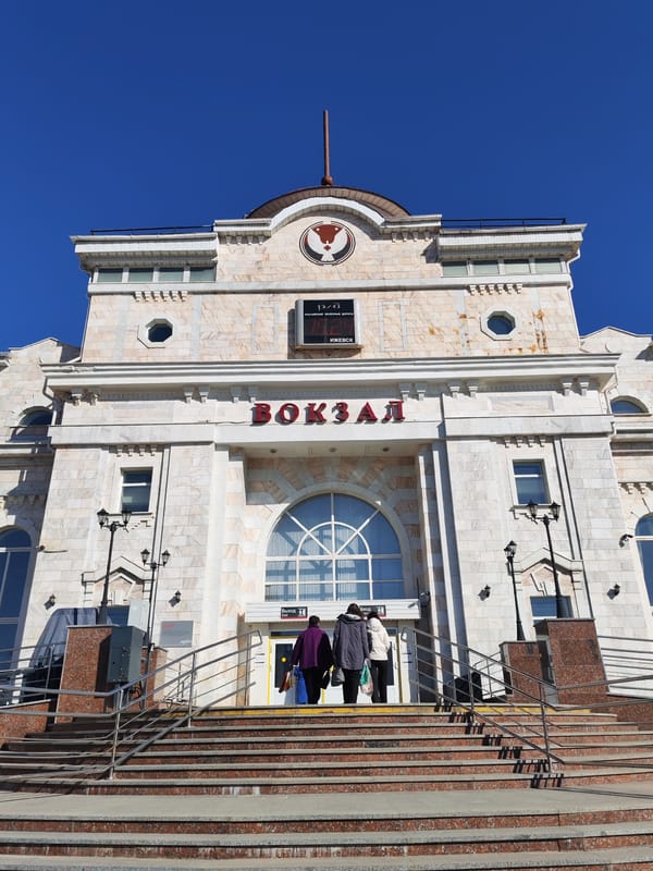 Witness documents Izhevsk train station complex on sunny spring day