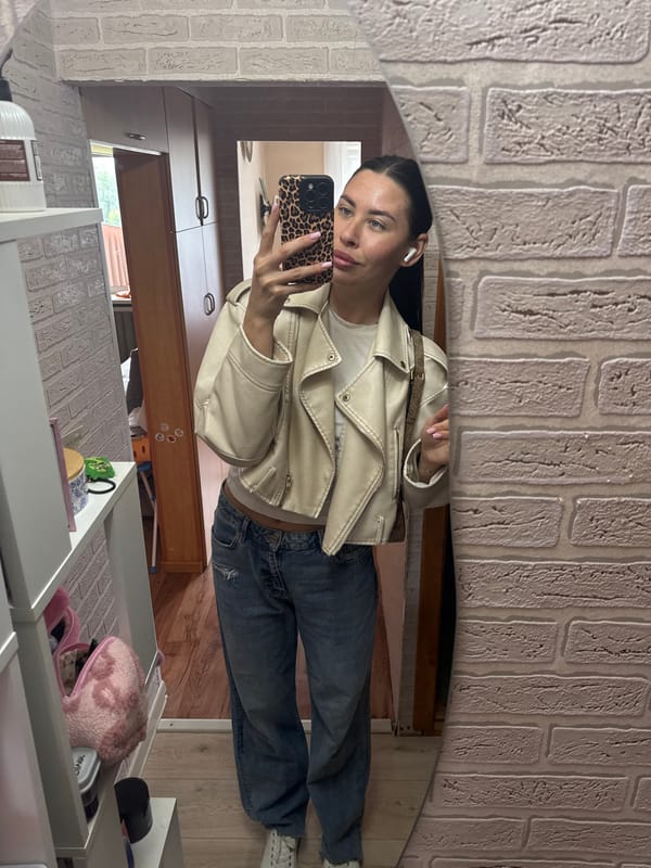 Mirror selfies in a brick-walled room, Chaikovsky