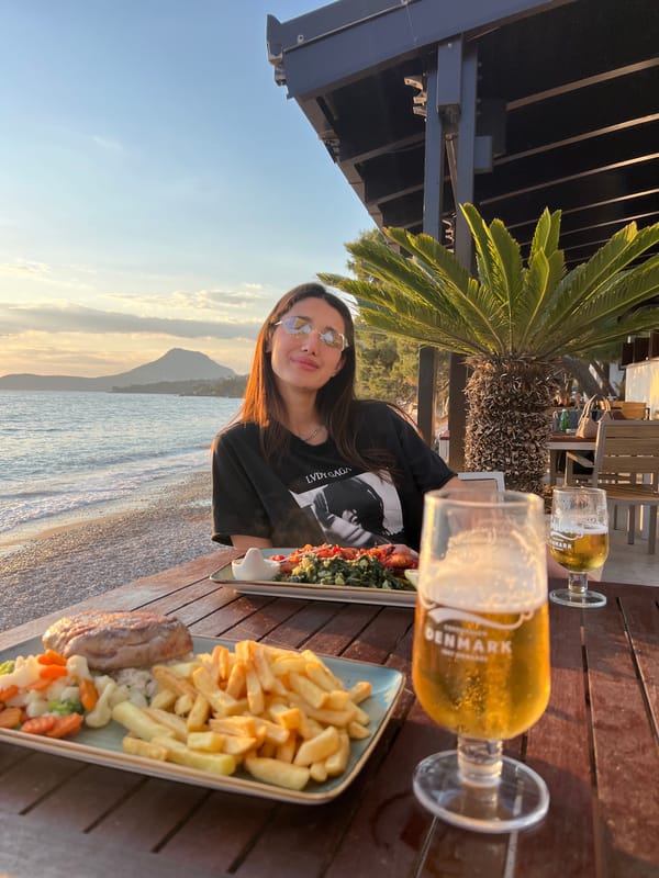 Woman enjoys beachside dining in Bar, Montenegro