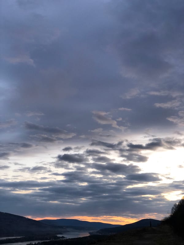 Sunset observed over Krasnoyarsk valley amid dramatic cloudy skies