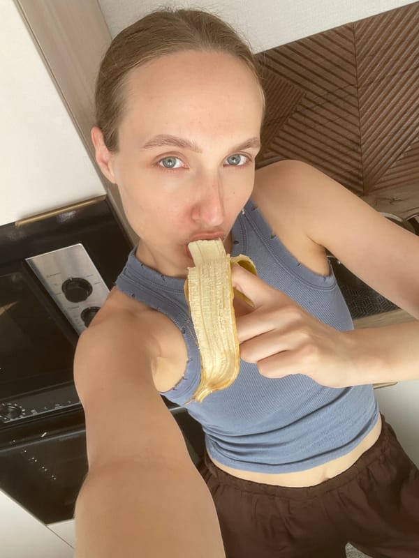 Woman eating banana in Russian kitchen caught on camera