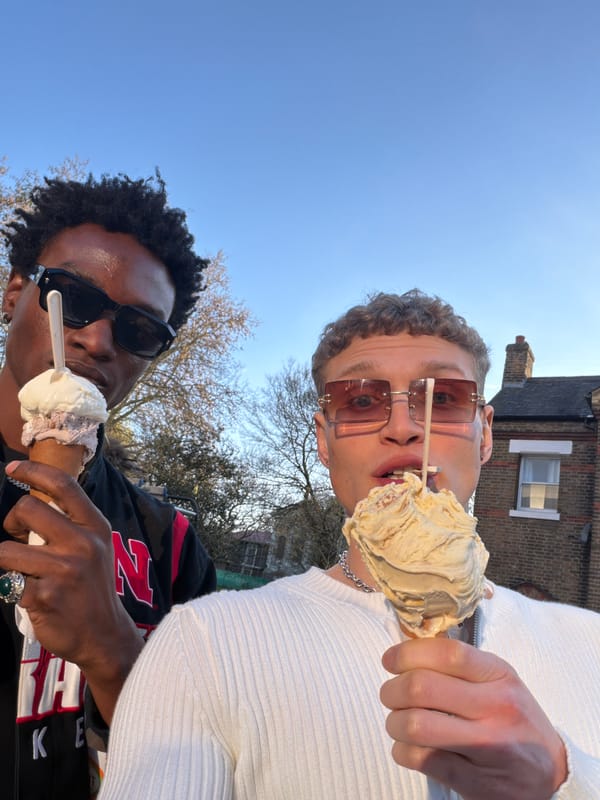 Young men take mirror selfies on London street
