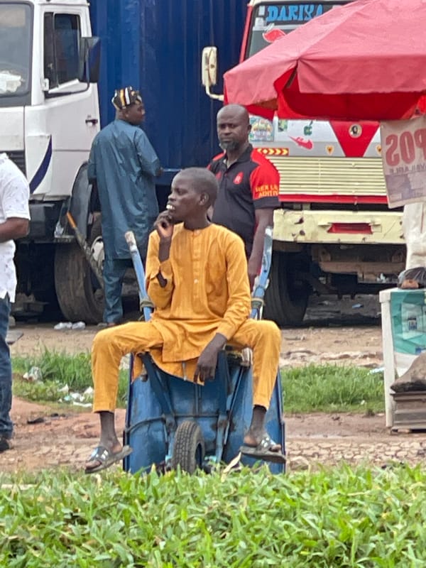 Morning commute through congested Abuja streets, overcast skies