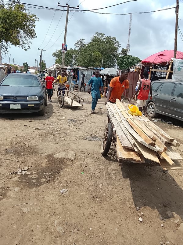 Daily commerce unfolds on Abuja's dusty market streets
