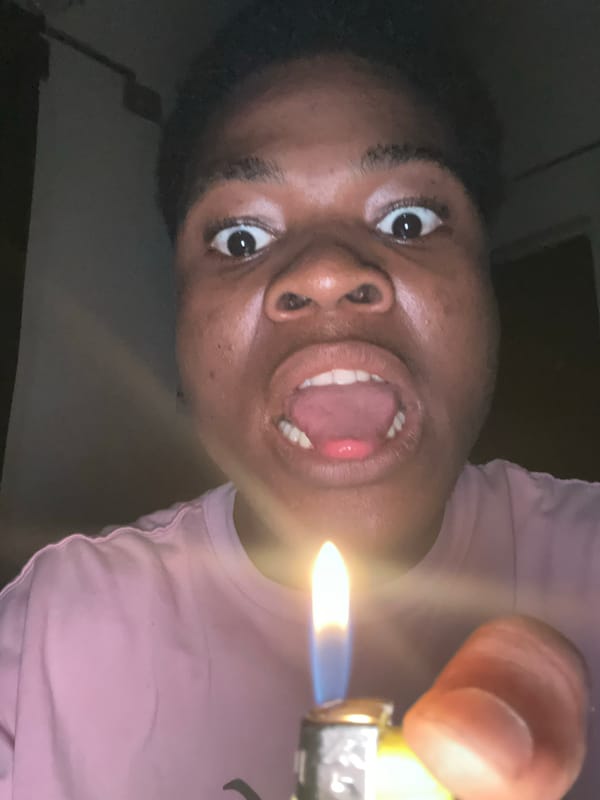 Bedroom selfie session with random props, Ihiagwa