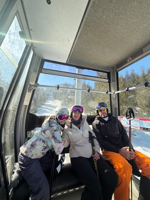 Skiers ride gondola lifts at Whistler resort