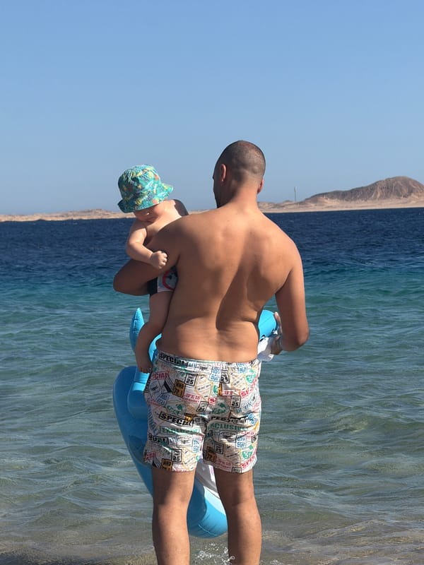 Family beach day in the shallows at Sharm El Sheikh