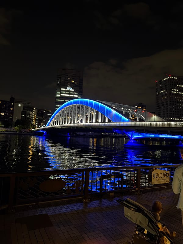 Blue-lit Kiyosu Bridge illuminated over Sumida River, Tokyo