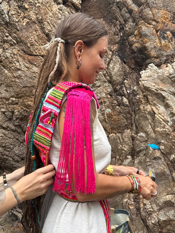 Woman explores coastal cliffs of Koh Phangan during overcast morning