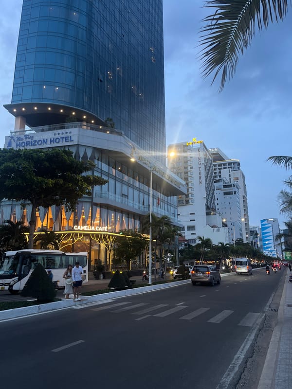 Beachfront hotels and shoreline crowds at dusk