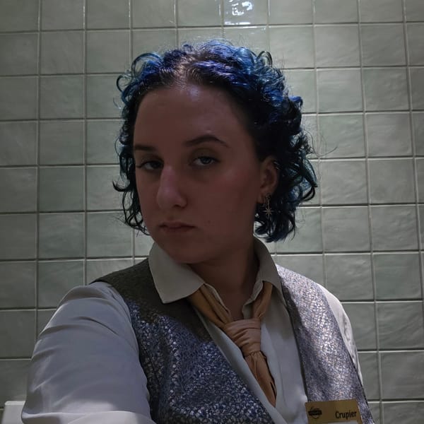 Blue-haired individual moves through Chișinău during afternoon hours