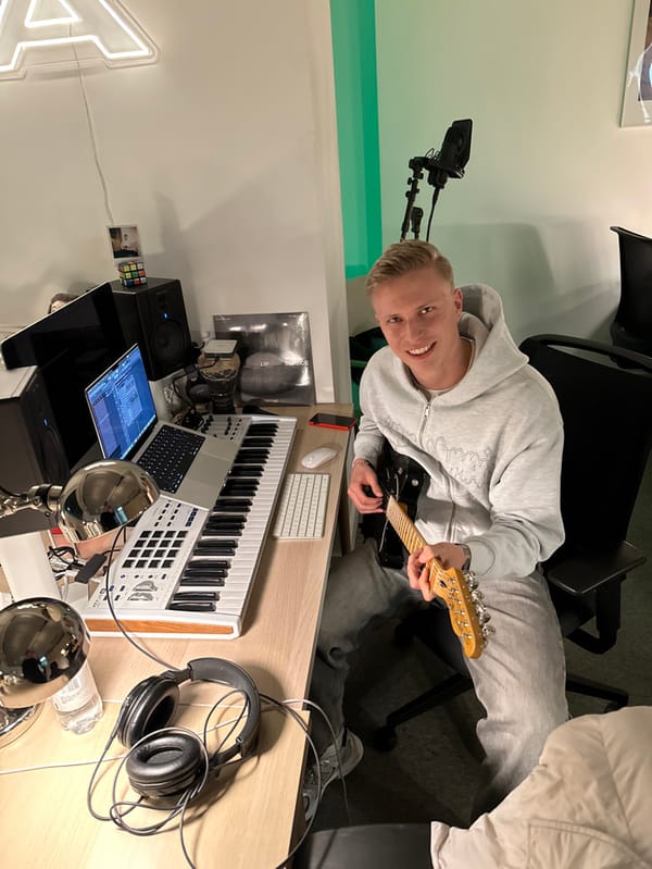 Musician records with electric guitar in London studio