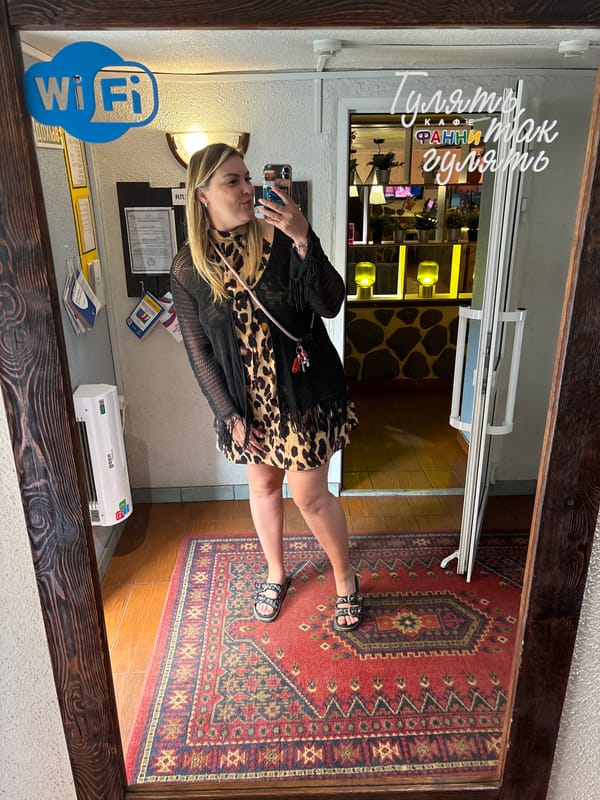 Mirror selfie in a Chaikovsky cafe, leopard print and fringe.