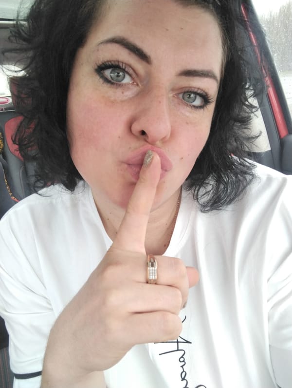 Woman takes playful car selfies during morning in Izhevsk