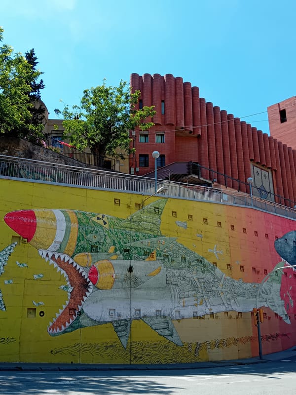 Street mural depicts money shark in Barcelona