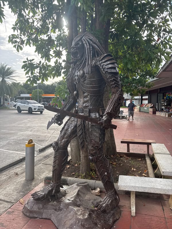 Scrap metal pop culture sculptures at a Thai roadside stop