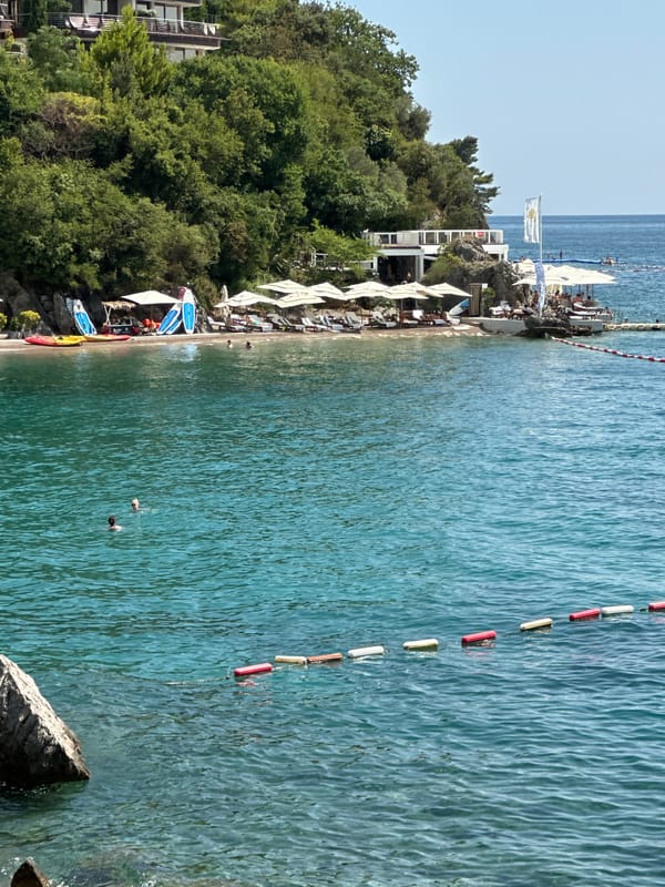Sunny afternoon swimming at a Boreti, Montenegro beach