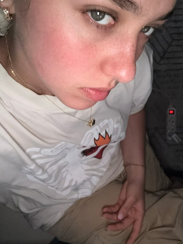 Woman in denim jacket recorded outdoors in sunny Milan