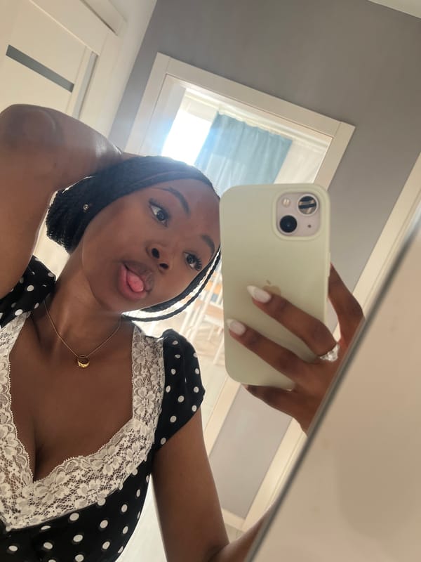 Woman takes mirror selfies in polka dot dress, Kazan