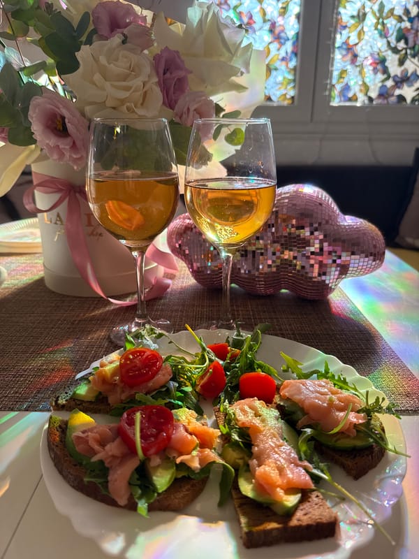 Champagne, flowers, and smoked salmon sandwiches for a lunch in