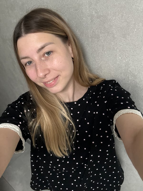 Woman poses for photos in Moscow apartment during evening