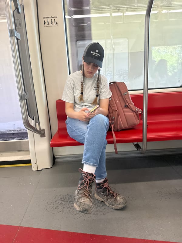 Passing time on Calgary transit, phone in hand