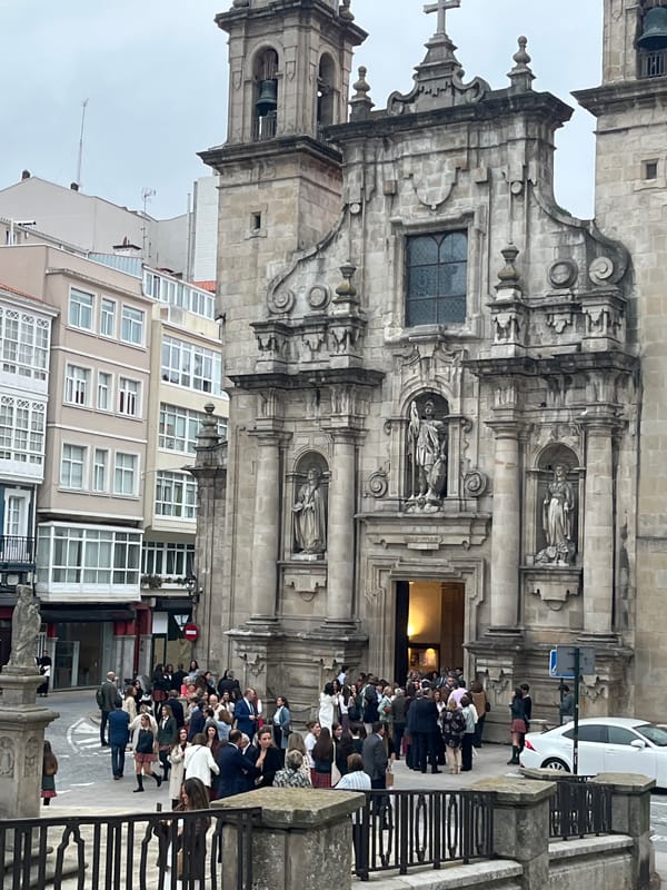 Crowd gathers at baroque church in A Coruña, Spain