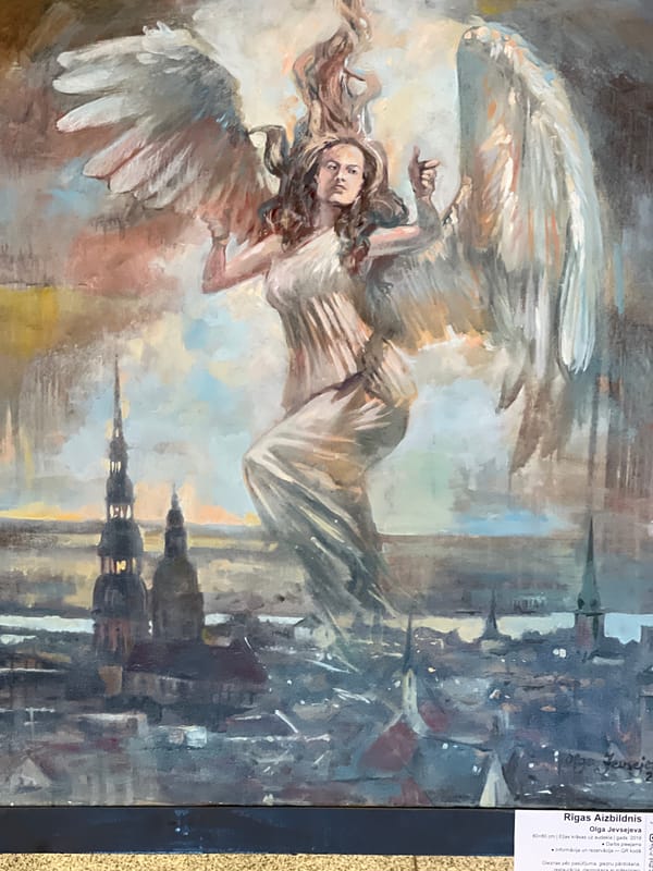 Visitor documents art and antique displays in Riga cultural venue