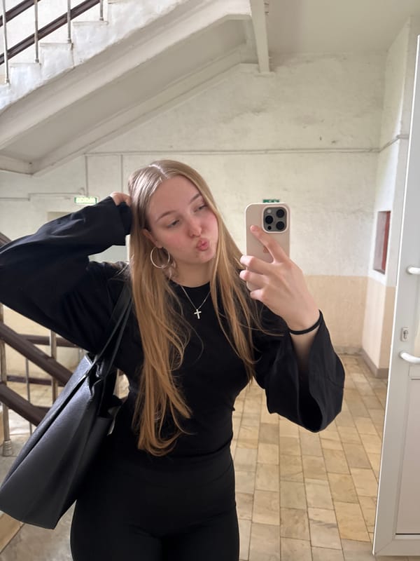 Woman takes selfies in public building in Perm
