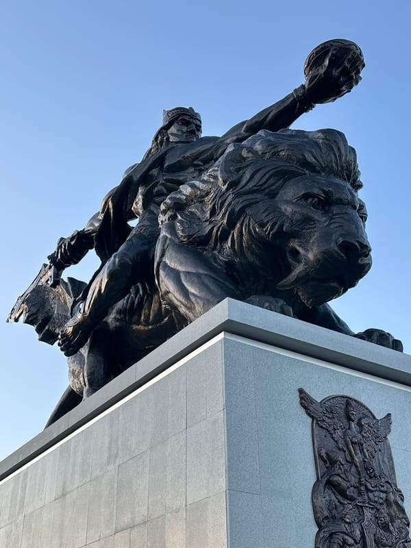 Observer documents statues, pinecones, and public art during afternoon walk