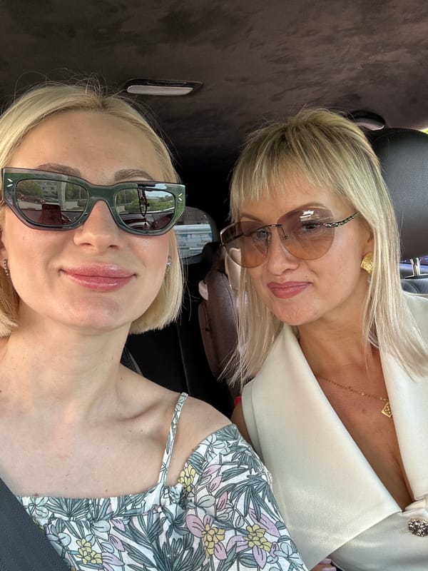 Women Take Selfies in Car with Children in Pushkino