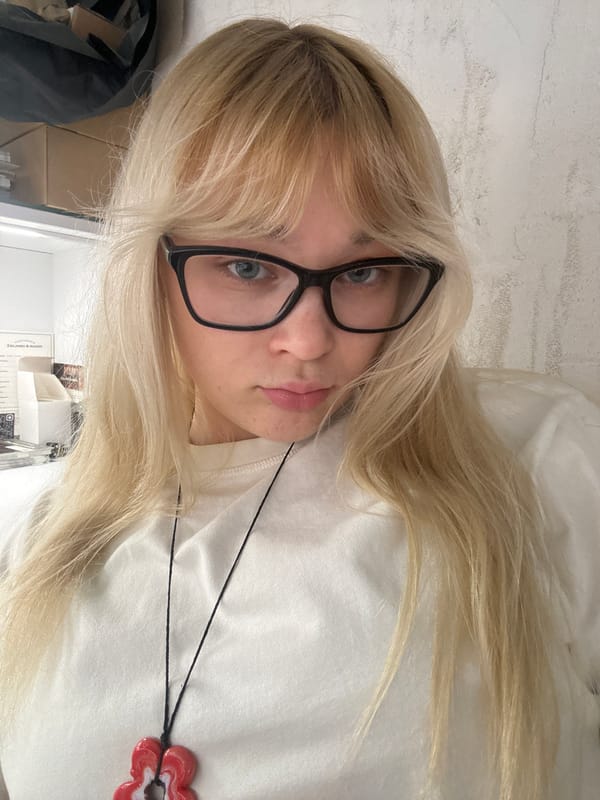 Casual selfie in Belgrade featuring glasses and a pendant.