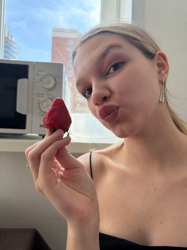 Couple shares fresh strawberries in Yekaterinburg morning