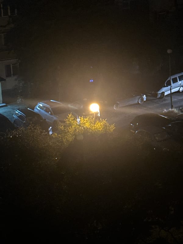 Nighttime scene at a Soviet-era apartment block