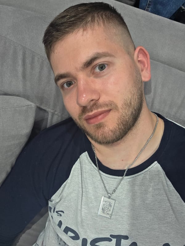 Man relaxes on sofa in Yagodovo home