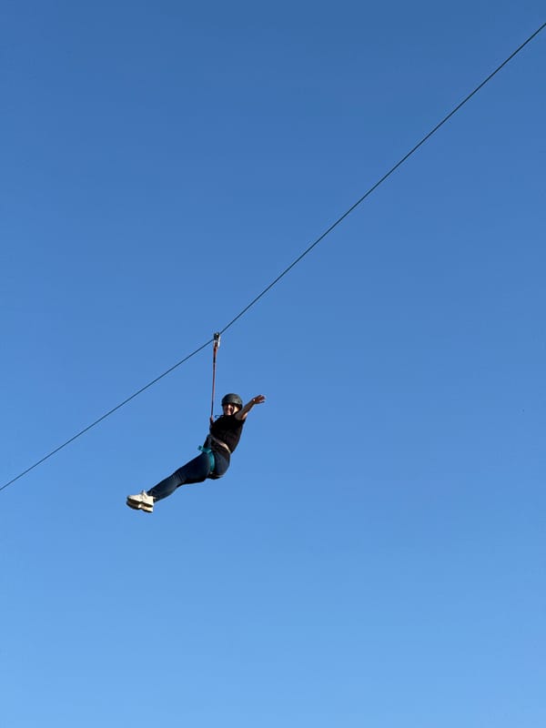Ziplines and inflatables at an outdoor activity park
