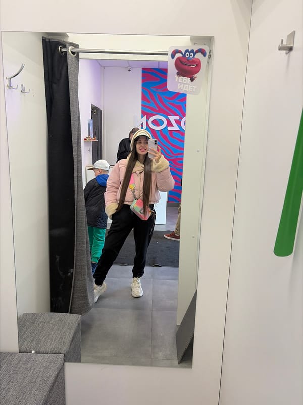 Woman takes fitting room selfie with child in Saint Petersburg