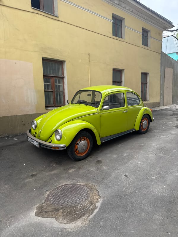 Lime-green Beetle and Moscow street details, afternoon.