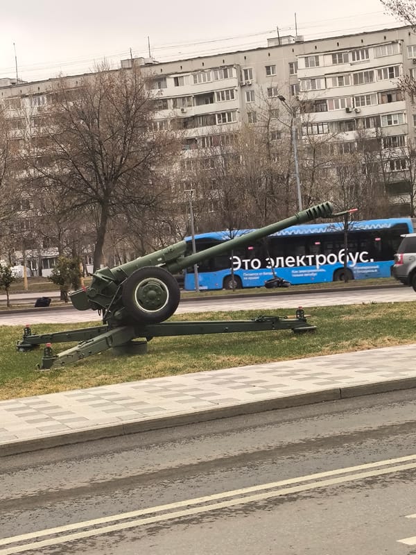 Moscow street scenes captured showing cannon display and roundabout sculpture