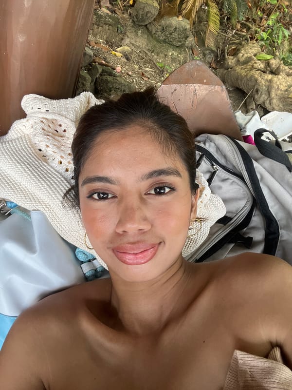 Woman rests, takes selfies at Banaybanay beach early morning
