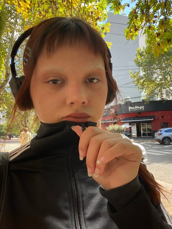 Person photographed outside Colegiales bodegón in Buenos Aires