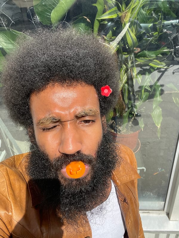 Portrait captured in Paris shows person with flower accessory