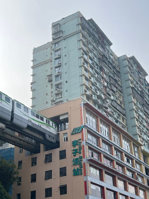 Crowds gather at Chongqing's building-piercing monorail station