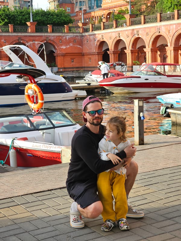 Man and child enjoy waterfront moment on Khimki pier