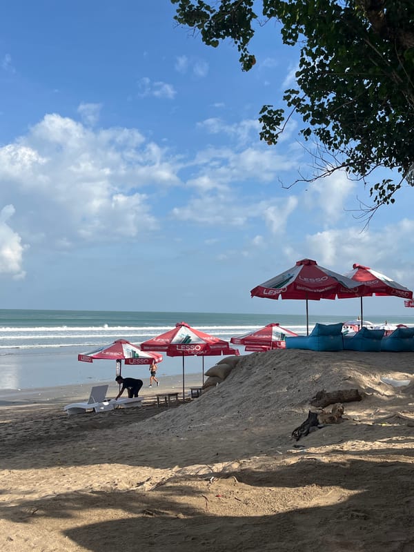 Kuta Beach in full swing — surf, sport, and shoreside lounging