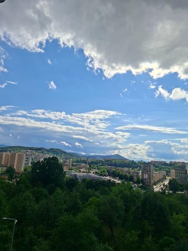 Panoramic view of Gabrovo cityscape under cloudy skies